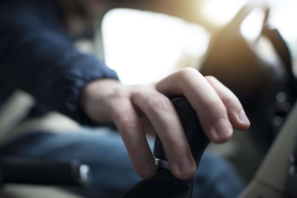 Driver with Hand on Stick Shift
